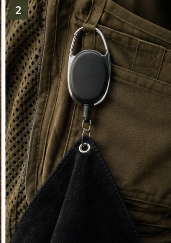 Range Standard Quick-Draw Towel retractable reel clipped to an olive shooting vest